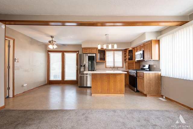 3034 190th St, Lansing, IL 60438 - kitchen with stainless steel appliances, baseboards, and healthy amount of natural light