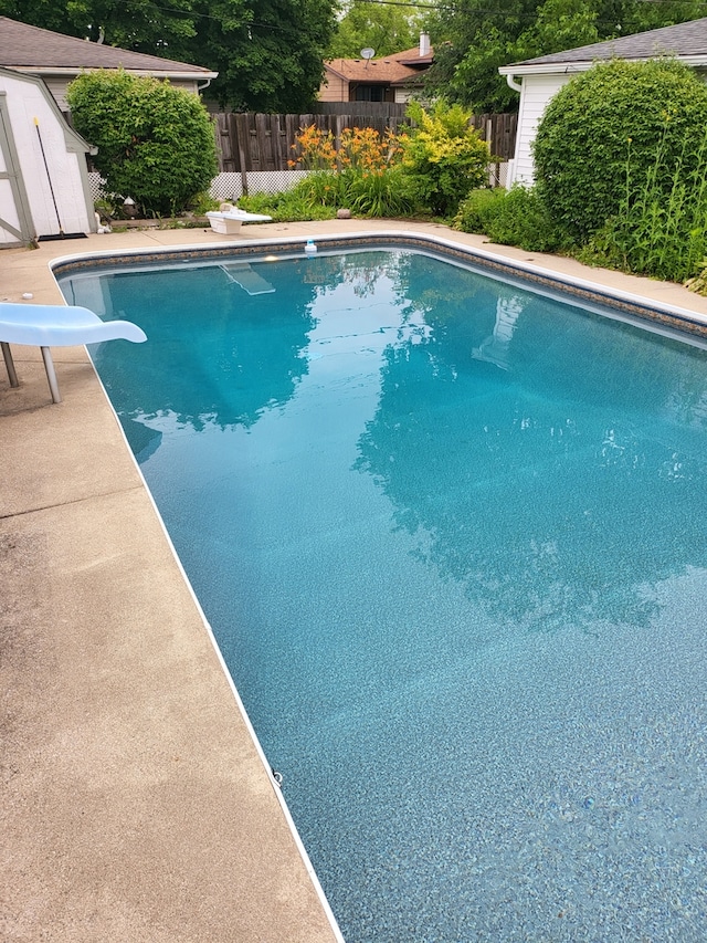 3034 190th St, Lansing, IL 60438 - view of pool featuring a water slide and a diving board