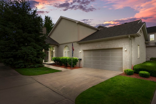 11104 Karen Dr, Orland Park, IL 60467 - view of front facade featuring driveway, a garage, a shingled roof, brick siding, and a front lawn