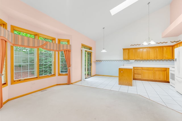 11104 Karen Dr, Orland Park, IL 60467 - kitchen with a skylight, a chandelier, high vaulted ceiling, light countertops, and white range oven