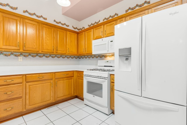 11104 Karen Dr, Orland Park, IL 60467 - kitchen with white appliances, light tile patterned floors, light countertops, and brown cabinets