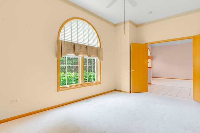 11104 Karen Dr, Orland Park, IL 60467 - spare room featuring crown molding, carpet floors, baseboards, and ceiling fan
