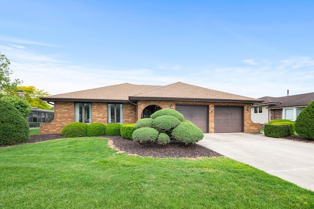 7618 W 157th St, Orland Park, IL 60462 - ranch-style home featuring an attached garage, driveway, brick siding, and a front yard