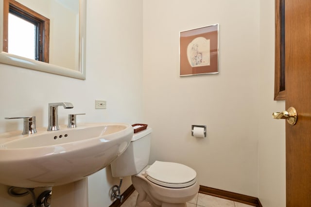7618 W 157th St, Orland Park, IL 60462 - bathroom with baseboards, toilet, a sink, and tile patterned floors