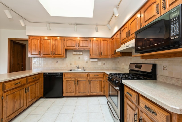 7618 W 157th St, Orland Park, IL 60462 - kitchen featuring black appliances, rail lighting, under cabinet range hood, brown cabinetry, and light countertops