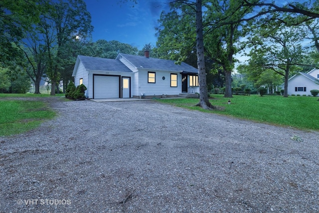 2309 N Riverside Dr, Mchenry, IL 60051 - ranch-style house featuring a garage, driveway, a chimney, a front lawn, and a shingled roof