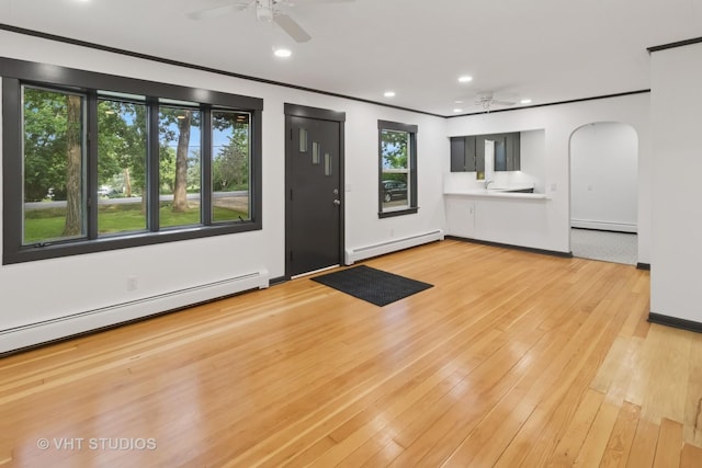 2309 N Riverside Dr, Mchenry, IL 60051 - entryway featuring a ceiling fan, a baseboard radiator, a baseboard heating unit, arched walkways, and recessed lighting
