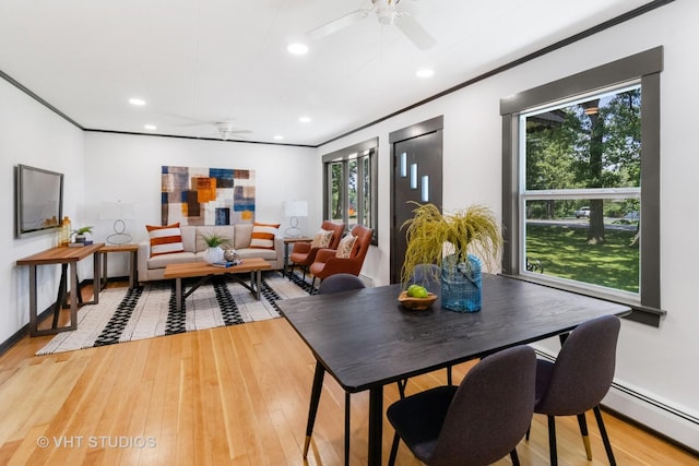 2309 N Riverside Dr, Mchenry, IL 60051 - dining space featuring ceiling fan, a baseboard heating unit, recessed lighting, light wood-style floors, and ornamental molding