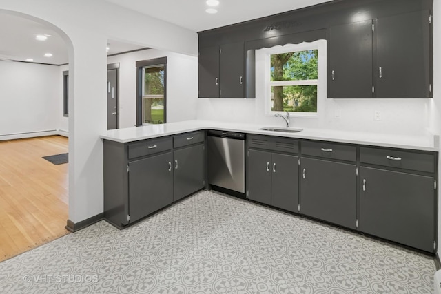 2309 N Riverside Dr, Mchenry, IL 60051 - kitchen with dishwasher, a sink, light countertops, arched walkways, and recessed lighting