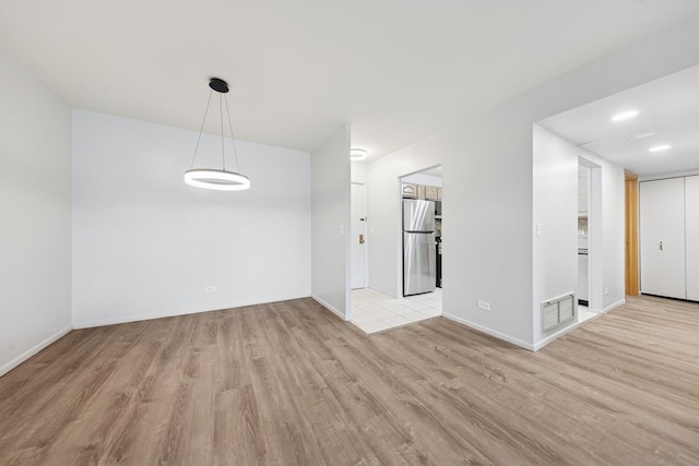 720 Wellington Ave Unit 206, Elk Grove Village, IL 60007 - unfurnished room with light wood-type flooring and baseboards