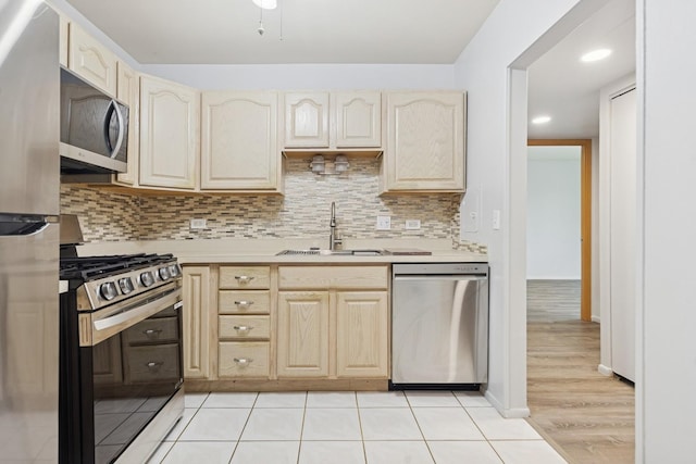 720 Wellington Ave Unit 206, Elk Grove Village, IL 60007 - kitchen with stainless steel appliances, a sink, light countertops, tasteful backsplash, and recessed lighting