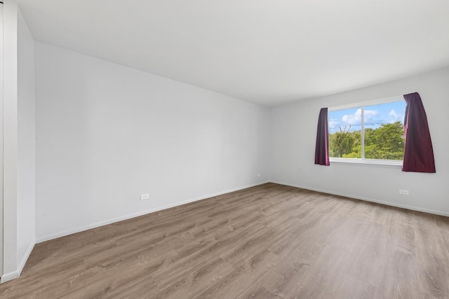 720 Wellington Ave Unit 206, Elk Grove Village, IL 60007 - unfurnished room featuring wood finished floors and baseboards