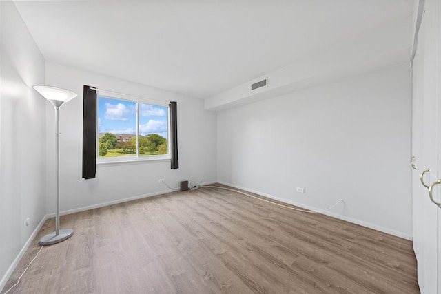 720 Wellington Ave Unit 206, Elk Grove Village, IL 60007 - spare room featuring wood finished floors and baseboards