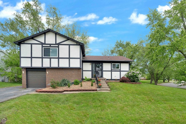 46 Cloverleaf Rd, Matteson, IL 60443 - tudor home featuring asphalt driveway, brick siding, stucco siding, a front lawn, and an attached garage