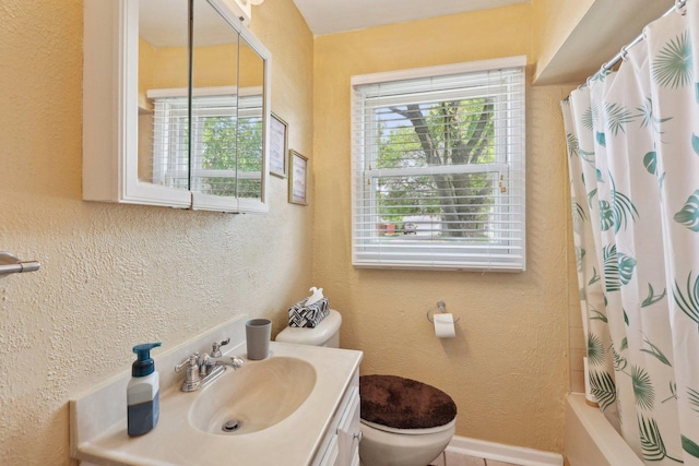 129 S Hammes Ave, Joliet, IL 60436 - full bath with toilet, healthy amount of natural light, vanity, and a textured wall