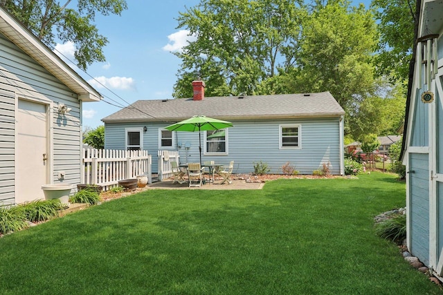 129 S Hammes Ave, Joliet, IL 60436 - back of property with a chimney and a patio area