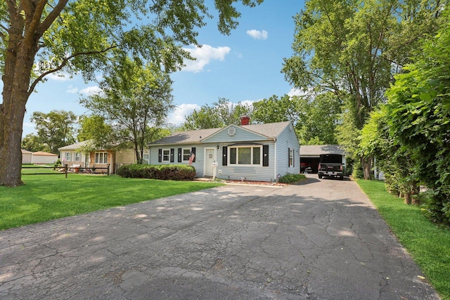 129 S Hammes Ave, Joliet, IL 60436 - single story home with a chimney, a front lawn, and driveway