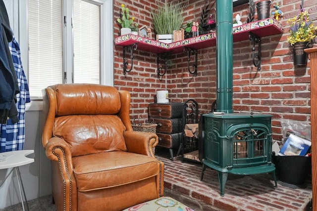 14848 Keystone Ave, Midlothian, IL 60445 - sitting room with brick flooring, a wood stove, and brick wall