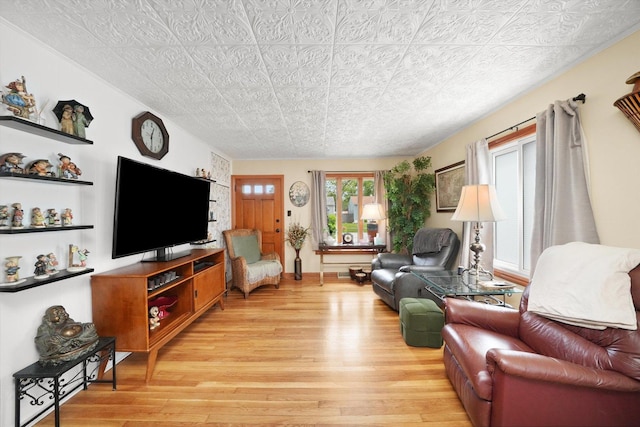 14848 Keystone Ave, Midlothian, IL 60445 - living room featuring light wood-style flooring and an ornate ceiling