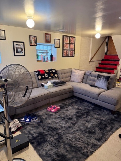 1723 N Monitor Ave, Chicago, IL 60639 - living area with stairs and light tile patterned floors