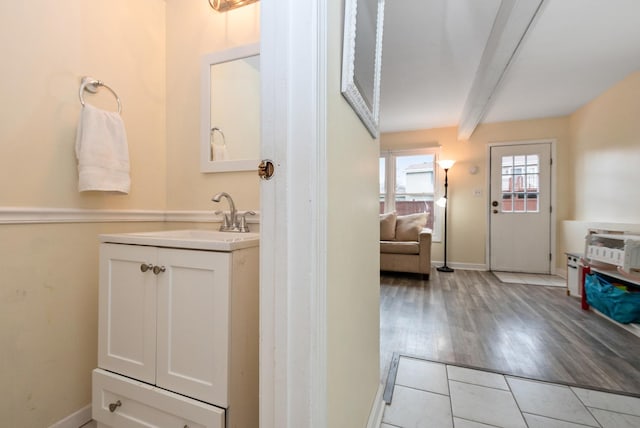 8048 W Magnolia Dr, Frankfort, IL 60423 - bathroom featuring vanity, baseboards, beamed ceiling, and wood finished floors