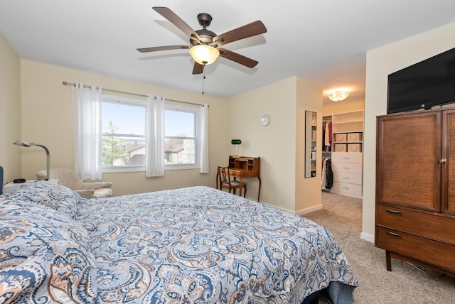 8048 W Magnolia Dr, Frankfort, IL 60423 - carpeted bedroom with a spacious closet, ceiling fan, and baseboards