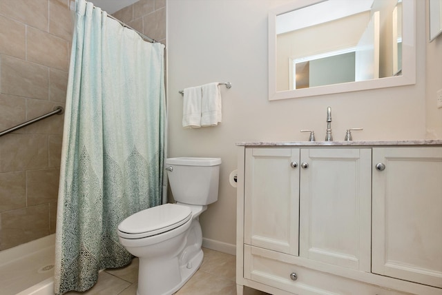 8048 W Magnolia Dr, Frankfort, IL 60423 - bathroom with toilet, vanity, tile patterned floors, a tile shower, and baseboards