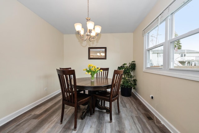 8048 W Magnolia Dr, Frankfort, IL 60423 - dining area with a chandelier, baseboards, and wood finished floors
