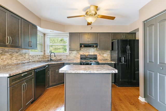 325 Indian Ridge Trl, Wauconda, IL 60084 - kitchen with range, black refrigerator with ice dispenser, exhaust hood, dishwasher, and a sink
