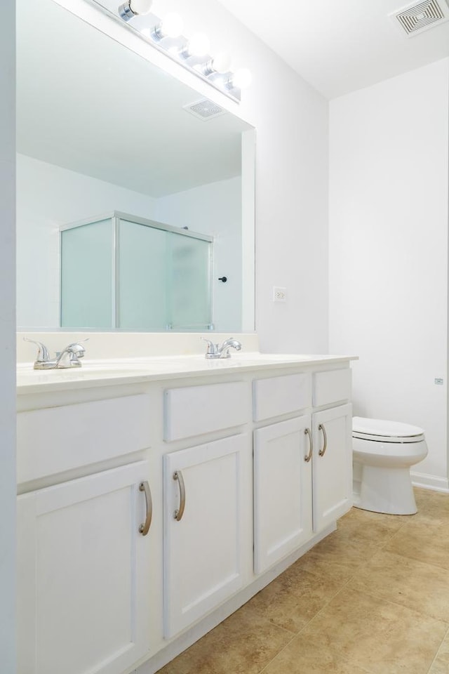 261 Springbrook Trl, Oswego, IL 60543 - bathroom with double vanity, toilet, and a shower with door