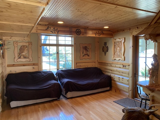 423 Mallard Pt, Danville, IL 61832 - bedroom featuring wood ceiling, multiple windows, light wood-type flooring, and wood walls