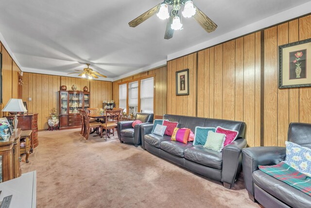 5434 W School St, Chicago, IL 60641 - carpeted living area with a ceiling fan and wooden walls