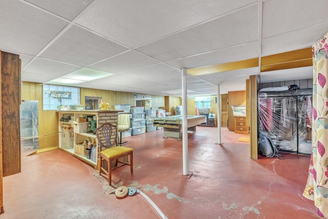 5434 W School St, Chicago, IL 60641 - below grade area featuring wood walls, plenty of natural light, and a paneled ceiling
