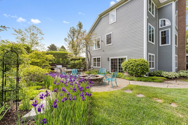 20142 N Deer Chase Ct, Deer Park, IL 60010 - back of property with an outdoor fire pit, a patio area, and a yard