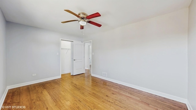 524 Escanaba Ave, Calumet City, IL 60409 - empty room with a ceiling fan, baseboards, and light wood-style floors