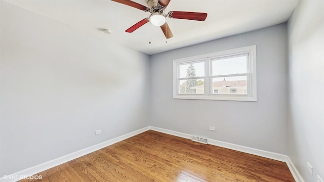 524 Escanaba Ave, Calumet City, IL 60409 - spare room featuring baseboards, light wood-style floors, a ceiling fan, and a smoke detector