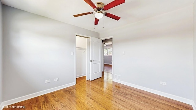 524 Escanaba Ave, Calumet City, IL 60409 - unfurnished bedroom featuring baseboards, light wood finished floors, a closet, and ceiling fan
