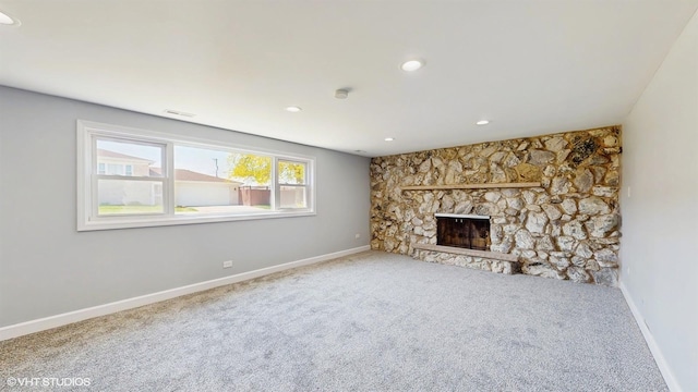 524 Escanaba Ave, Calumet City, IL 60409 - unfurnished living room with carpet flooring, baseboards, a stone fireplace, and recessed lighting