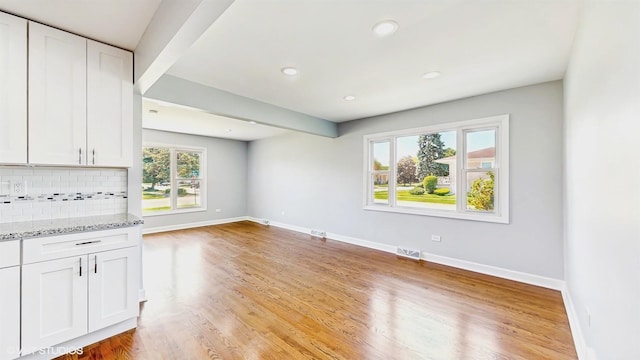 524 Escanaba Ave, Calumet City, IL 60409 - unfurnished living room with baseboards, light wood-type flooring, and recessed lighting