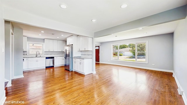 524 Escanaba Ave, Calumet City, IL 60409 - kitchen with stainless steel appliances, open floor plan, a sink, healthy amount of natural light, and recessed lighting
