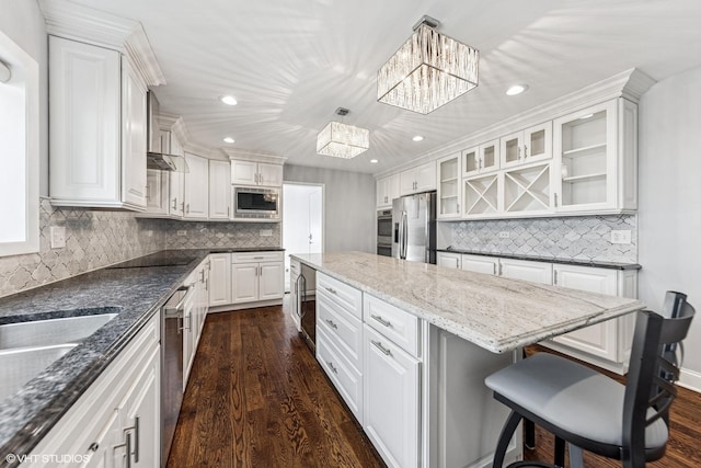 265 W Adams St, Elmhurst, IL 60126 - kitchen featuring stainless steel appliances, a chandelier, a center island, decorative backsplash, and dark wood-style flooring
