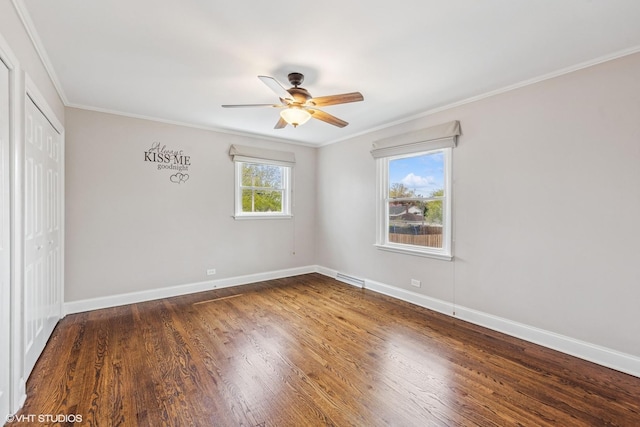 265 W Adams St, Elmhurst, IL 60126 - unfurnished bedroom with a closet, ornamental molding, baseboards, wood finished floors, and ceiling fan