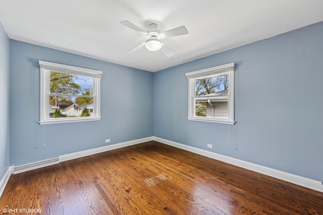 265 W Adams St, Elmhurst, IL 60126 - unfurnished room with healthy amount of natural light, baseboards, and dark wood-style floors