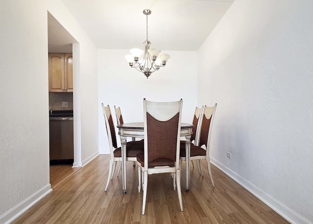 1 Renaissance Pl Unit 805, Palatine, IL 60067 - dining area featuring a chandelier, light wood-style floors, and baseboards