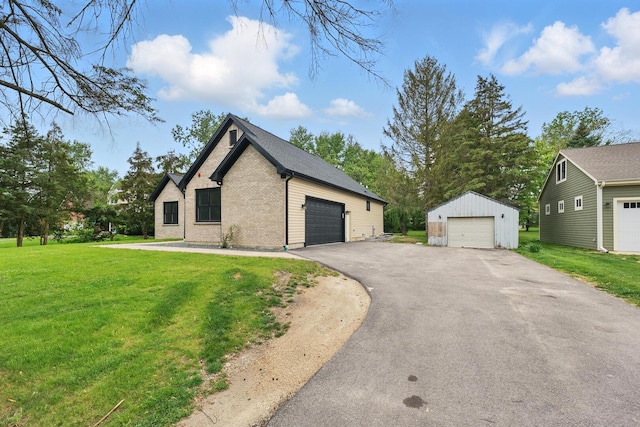 3026 Jackson Dr, Arlington Heights, IL 60004 - view of home's exterior with a detached garage, a yard, brick siding, and an outbuilding