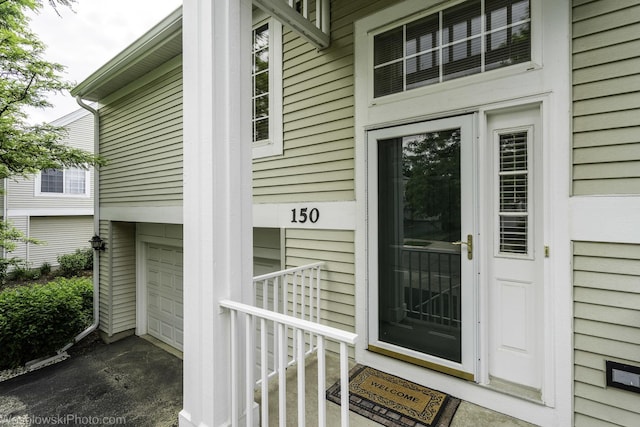 150 Lucerne Ct Unit 150, Wheeling, IL 60090 - property entrance featuring an attached garage