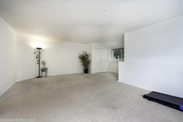 150 Lucerne Ct Unit 150, Wheeling, IL 60090 - spare room featuring light carpet and baseboards