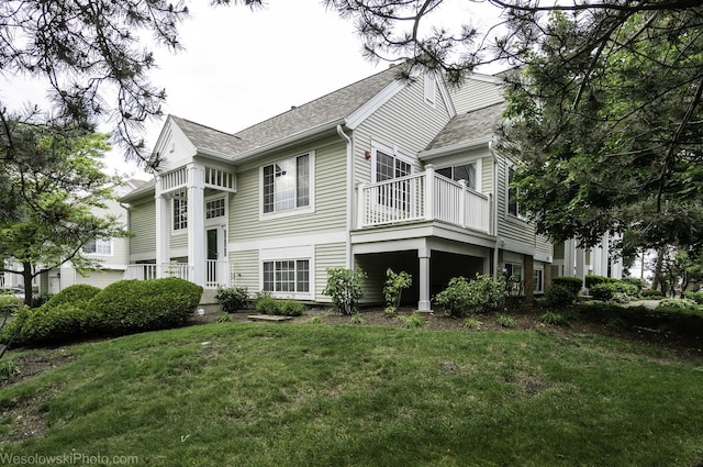 150 Lucerne Ct Unit 150, Wheeling, IL 60090 - view of side of home featuring a lawn and a shingled roof
