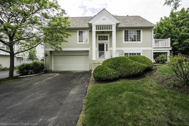 150 Lucerne Ct Unit 150, Wheeling, IL 60090 - raised ranch with asphalt driveway, an attached garage, and a shingled roof