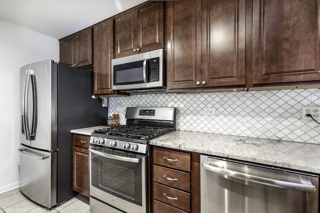 150 Lucerne Ct Unit 150, Wheeling, IL 60090 - kitchen featuring stainless steel appliances, backsplash, light tile patterned floors, and dark brown cabinets